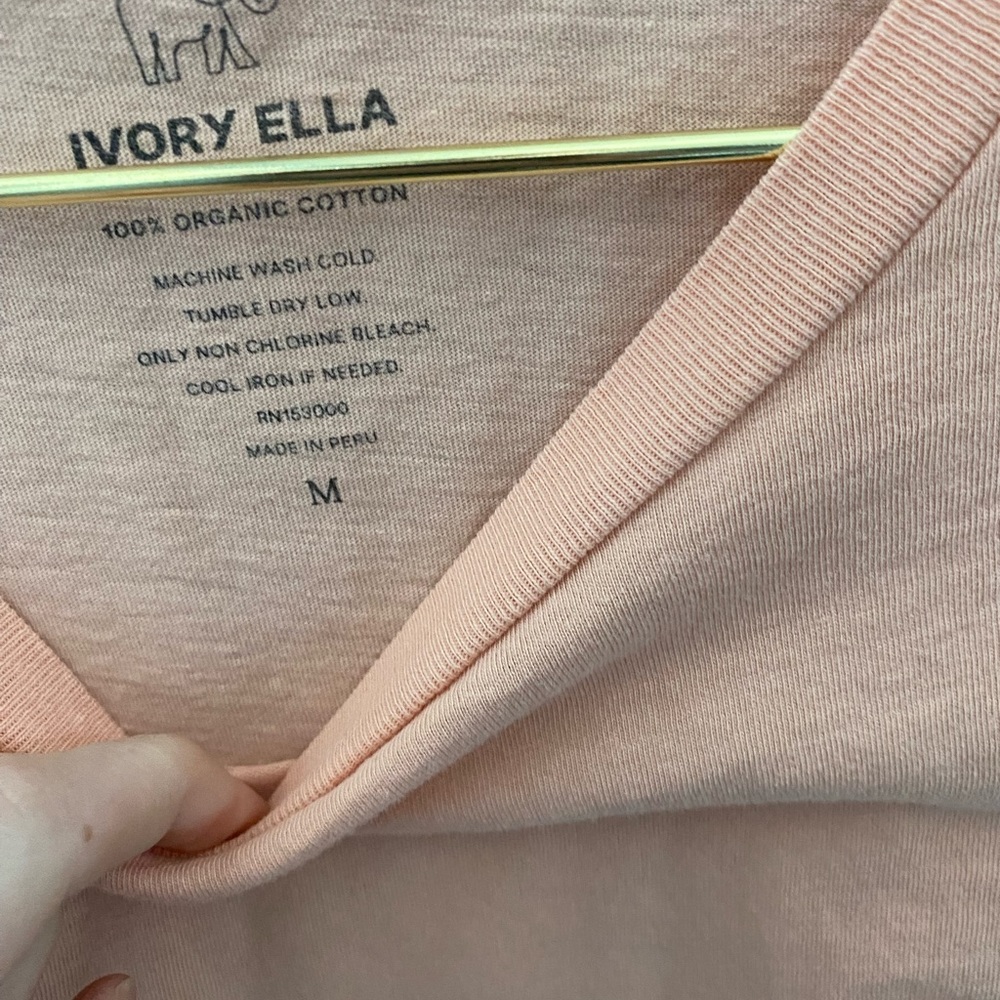 Peach colored long sleeve vineyard vines tee.